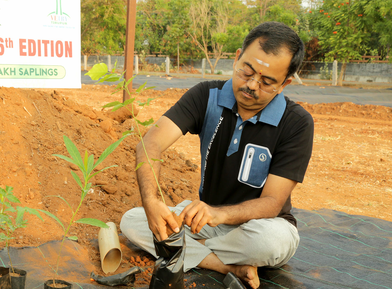T.R. Sivaram planting saplings